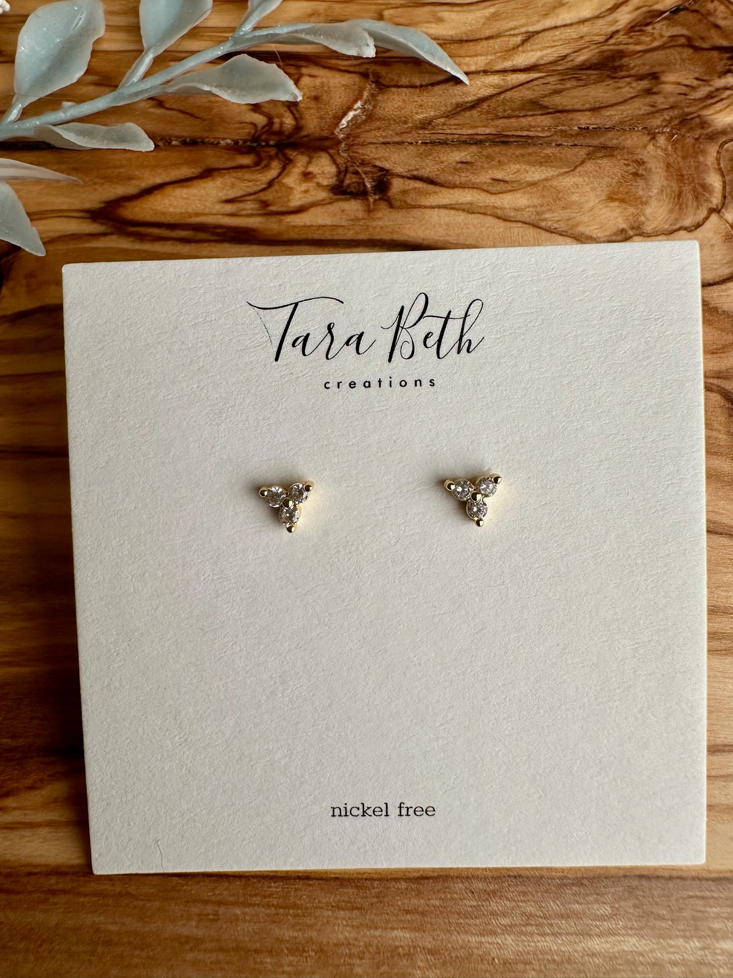 Diamond Cluster Studs with gold coloring, three-stone cluster design, dainty size, and nickel-free stud closure