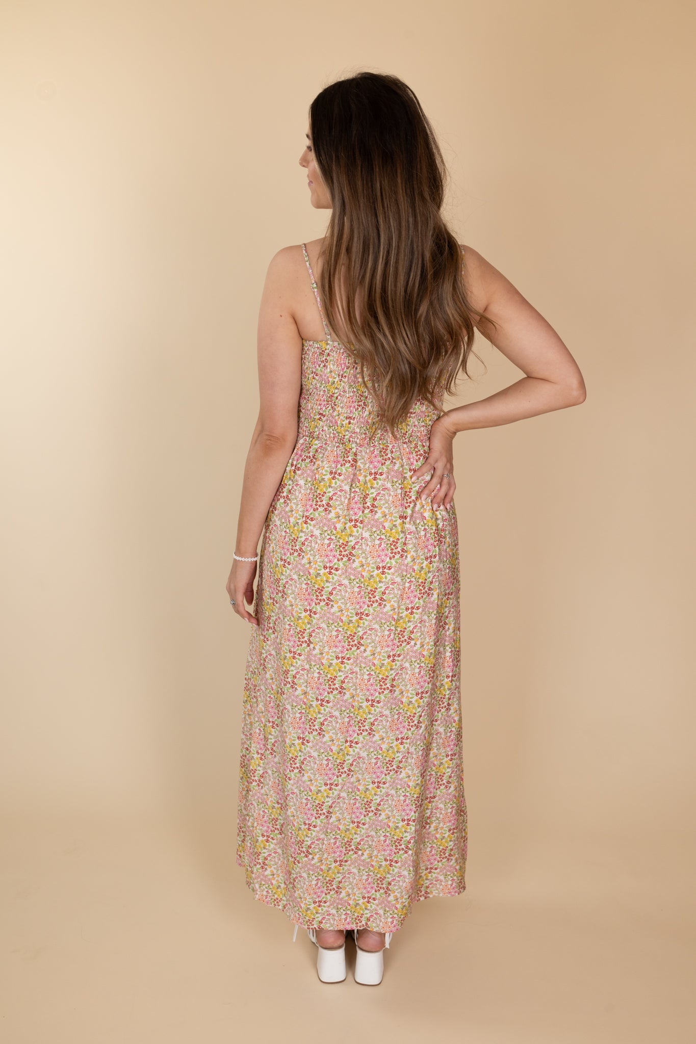 back view of “Maria Lace-Up Floral Midi Dress – a romantic floral print dress with lace-up detailing for a flattering, feminine look.”