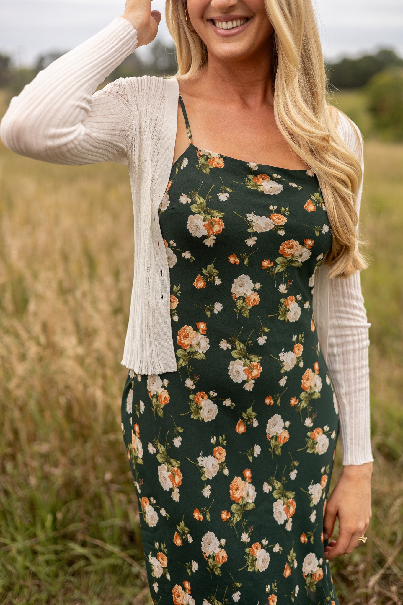 light weight cream ribbed sweater unbuttoned paired with floral slip dress