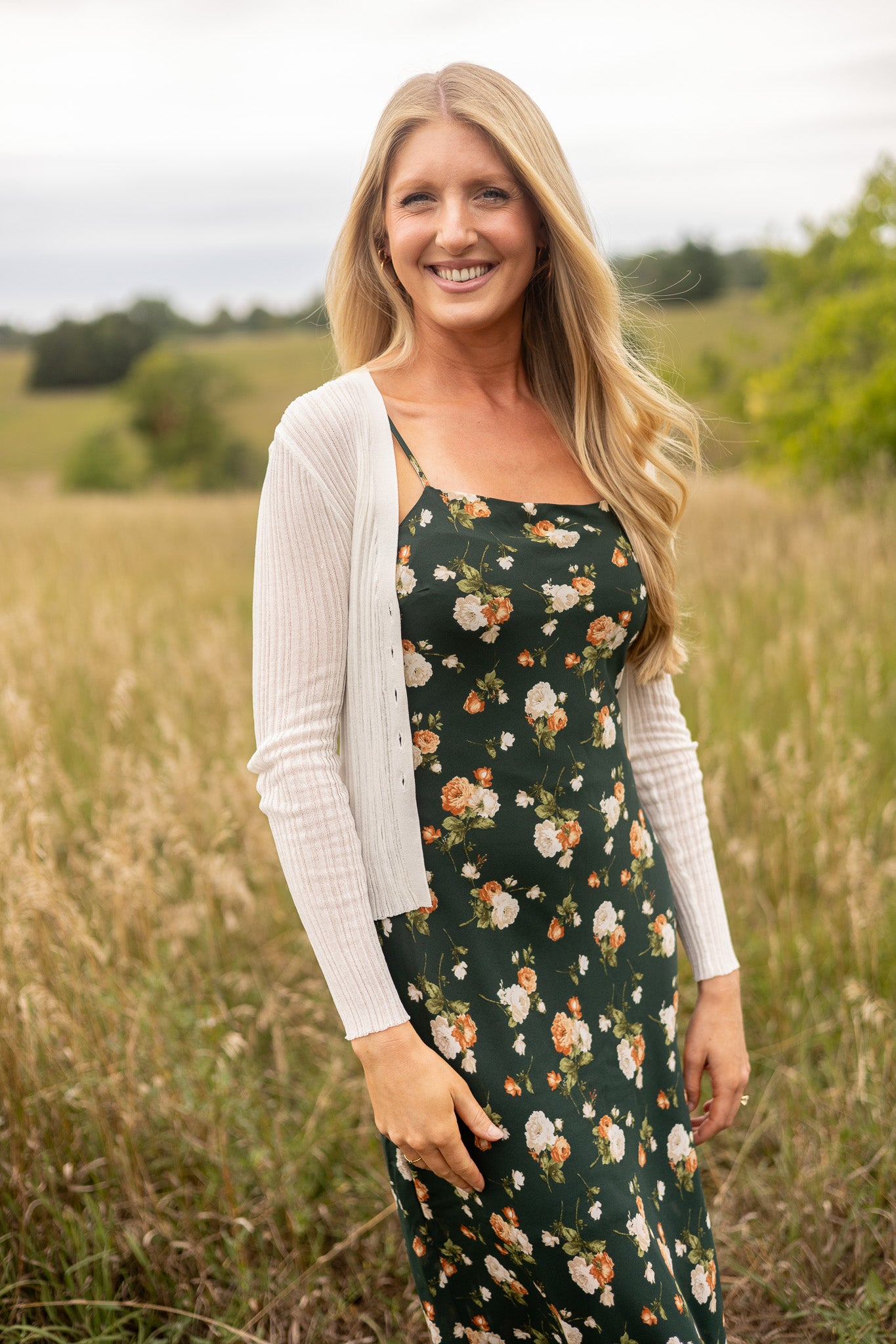 full view of light weight cream ribbed sweater paired with floral slip dress, great over thin straps