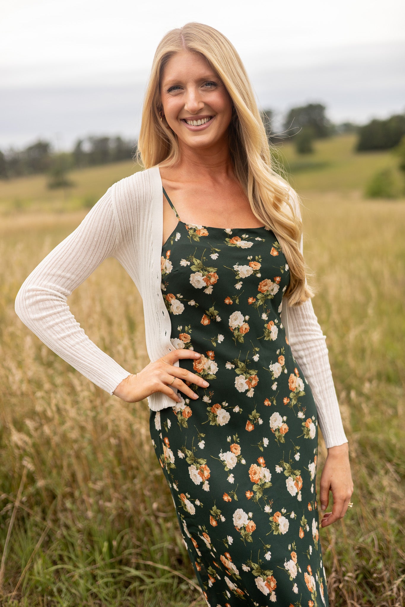 side view of light weight cream ribbed sweater paired with floral slip dress