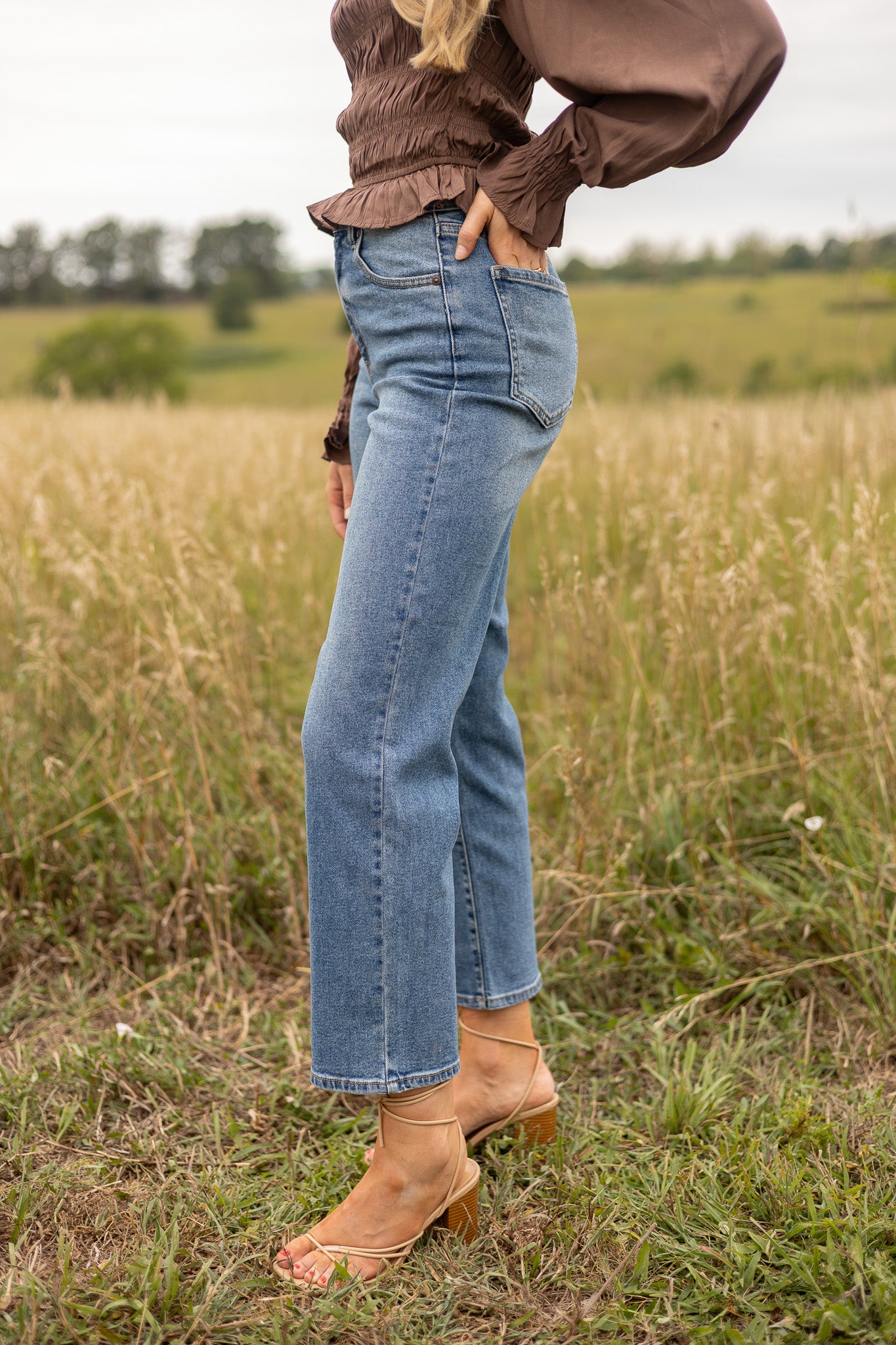 side view view of medium wash straight leg denim