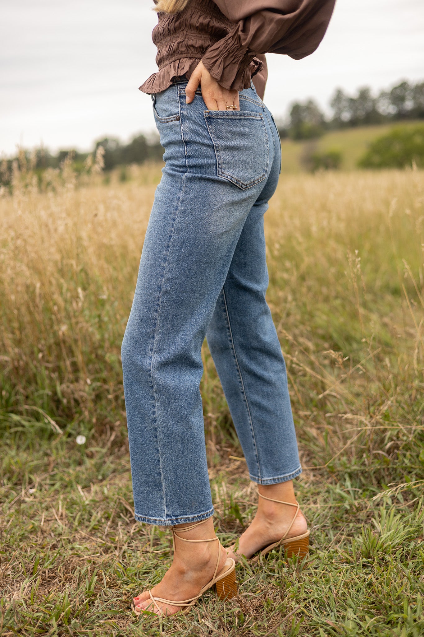 back side view of medium wash straight leg denim, full back pockets