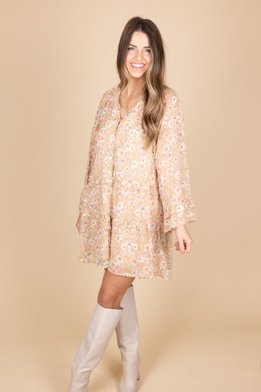 Finley Floral Buttoned Down Mini Dress front view showing tiered ruffles and bell sleeves. Paired with cream leather tall boots.
