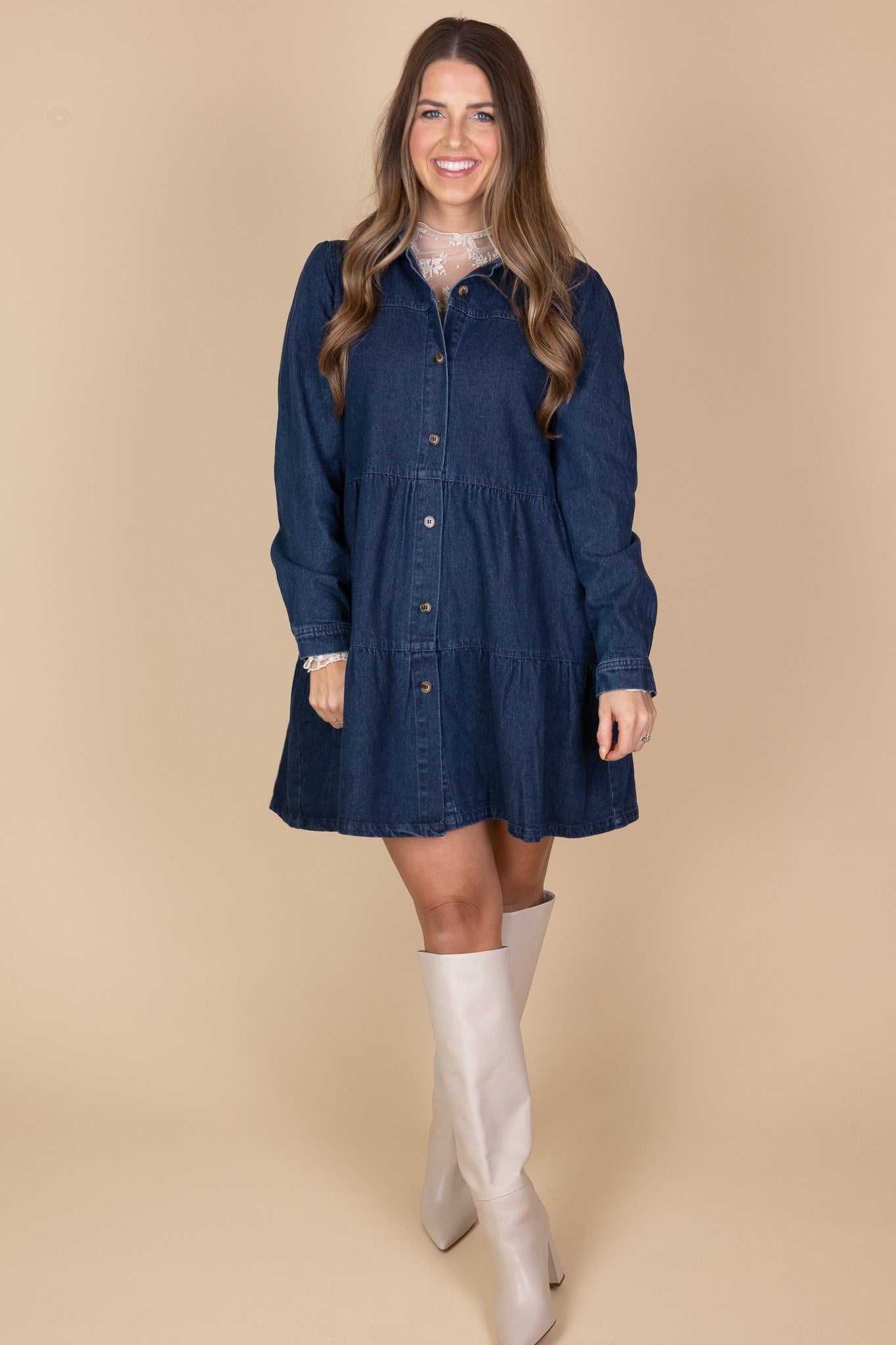 alternate styled view of Amelia Jean Dress in medium to dark wash with tiered bodice, long sleeves, and button closures for a stylish, versatile look.