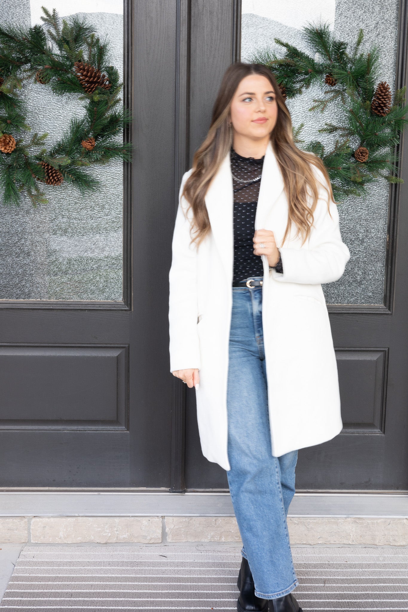 coat view with “Peyton Straight Leg Jeans – medium wash denim with a classic straight-leg cut for a flattering and timeless fit.”