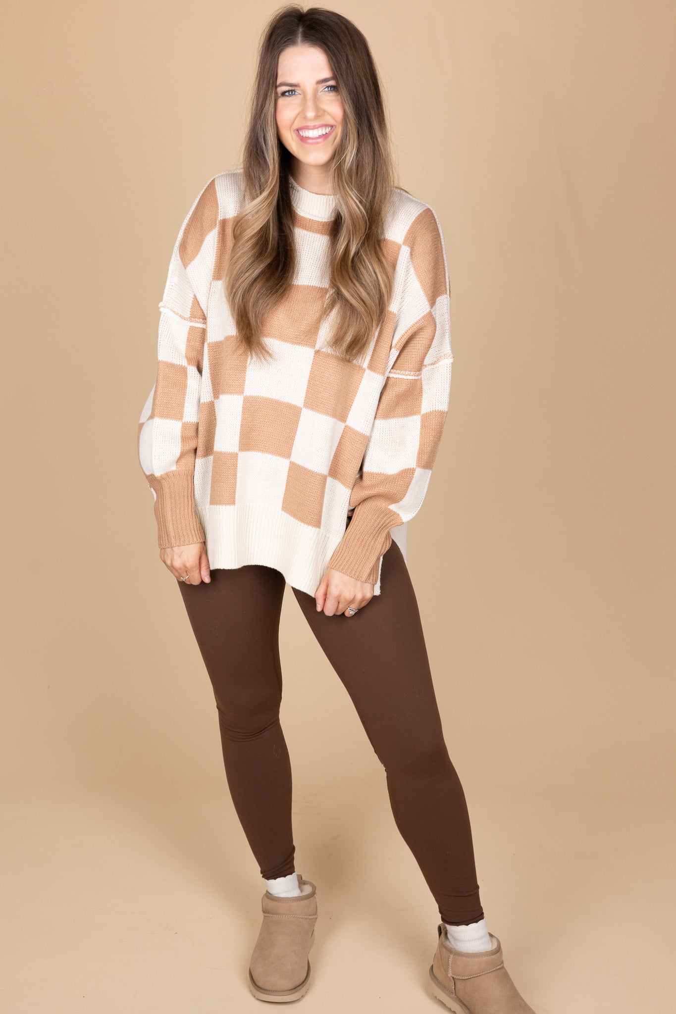 front view of “Cozy Checkered Crewneck Sweater – a soft knit sweater with a stylish checkered pattern and relaxed fit for effortless comfort.”