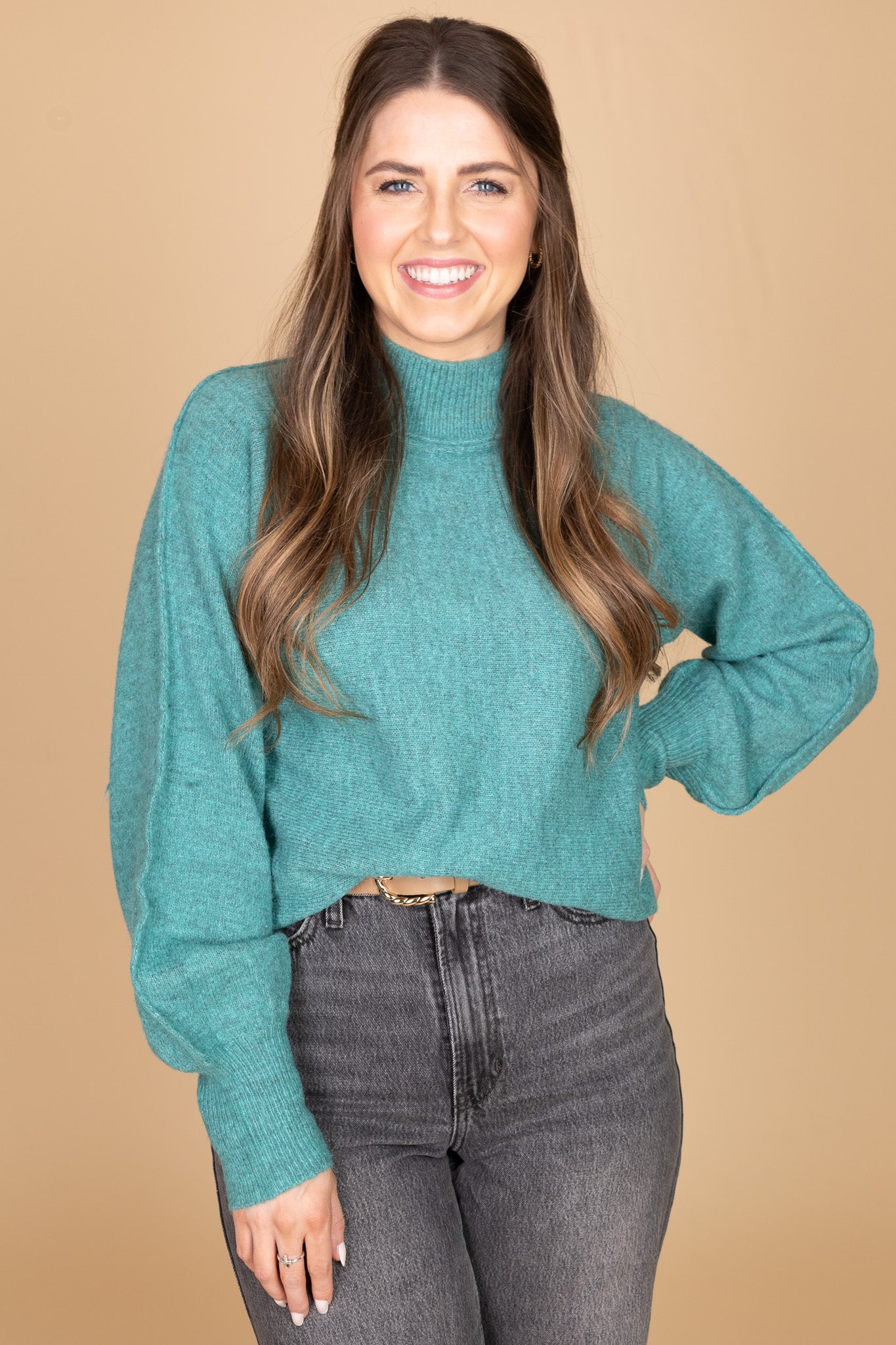 “Madeline Mock Neck Sweater – a soft ribbed knit sweater with a relaxed fit and elegant mock neckline.”
