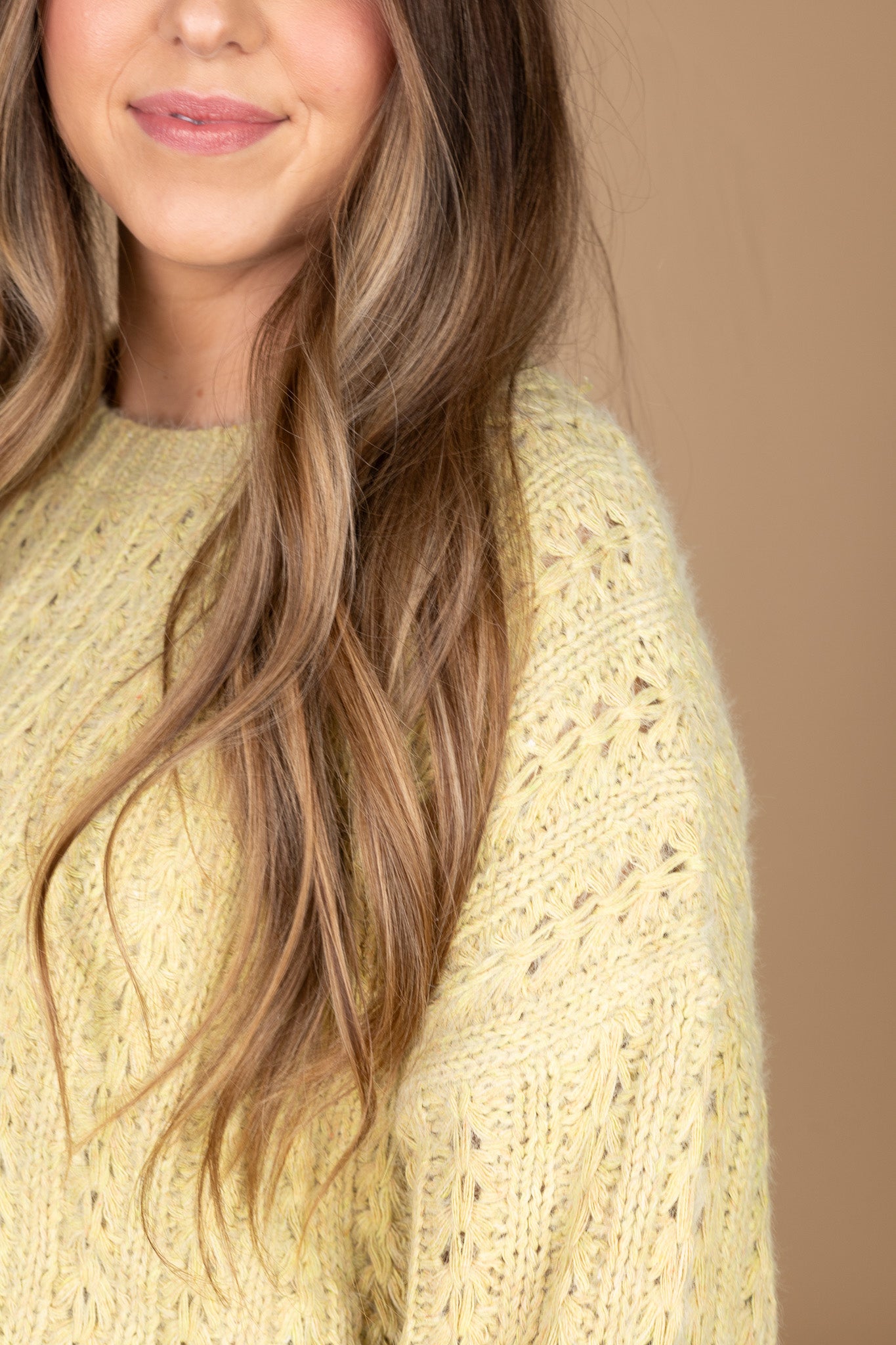 shoulder view of “Maisey Detailed Knit Sweater – a soft and cozy sweater with intricate stitching and a relaxed fit for effortless style.”
