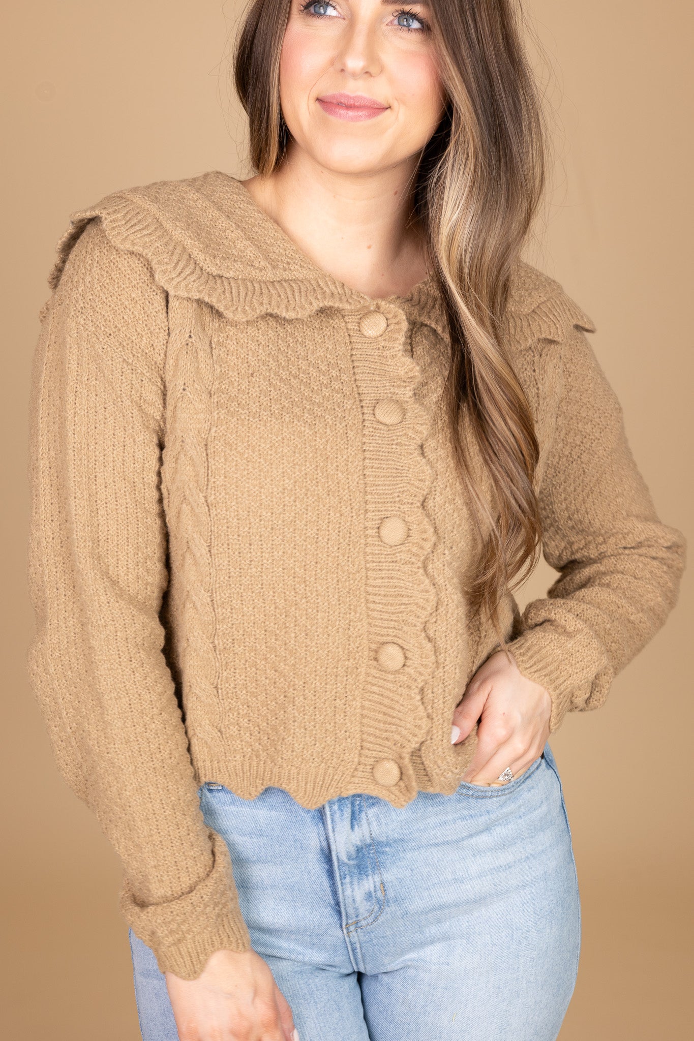 “Ava Scalloped Knit Cardigan – a soft and elegant knit cardigan with delicate scalloped edges for a feminine touch.”