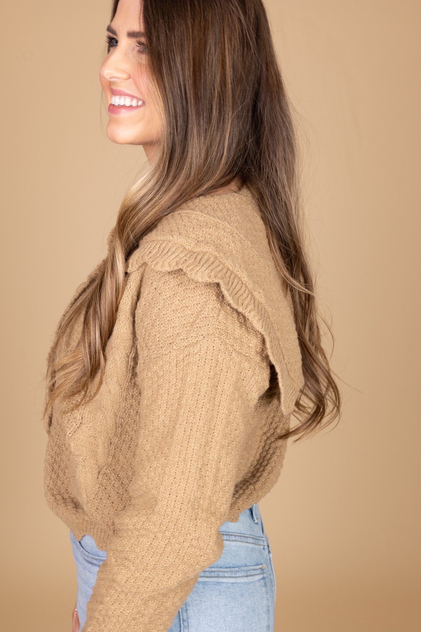 side view of “Ava Scalloped Knit Cardigan – a soft and elegant knit cardigan with delicate scalloped edges for a feminine touch.”