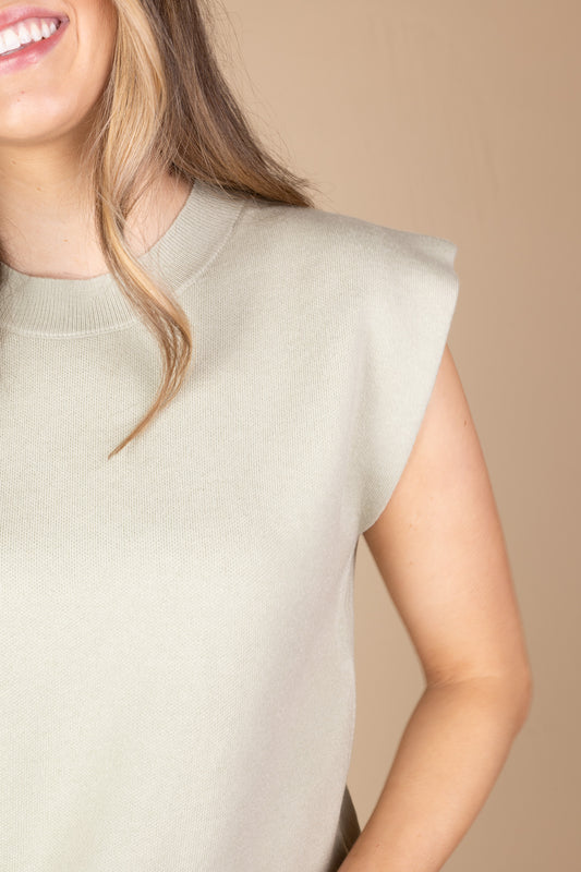 shoulder view Kyla Knit Top in pistachio green with stretch knit material, true to size fit, and versatile styling for everyday wear