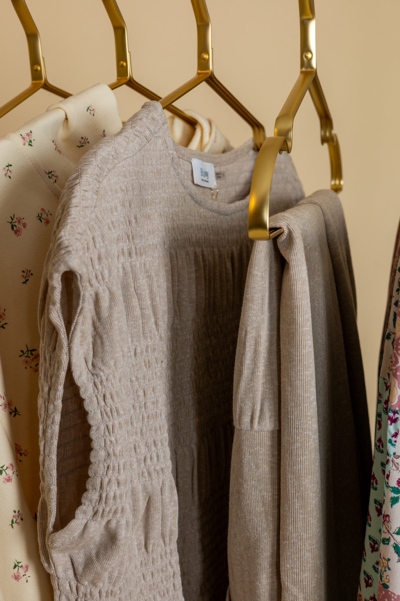 hanging Keep It Comfy All Day Set in taupe with lightweight fabric, ruffle detailing on top, and elastic waistband bottoms with pockets