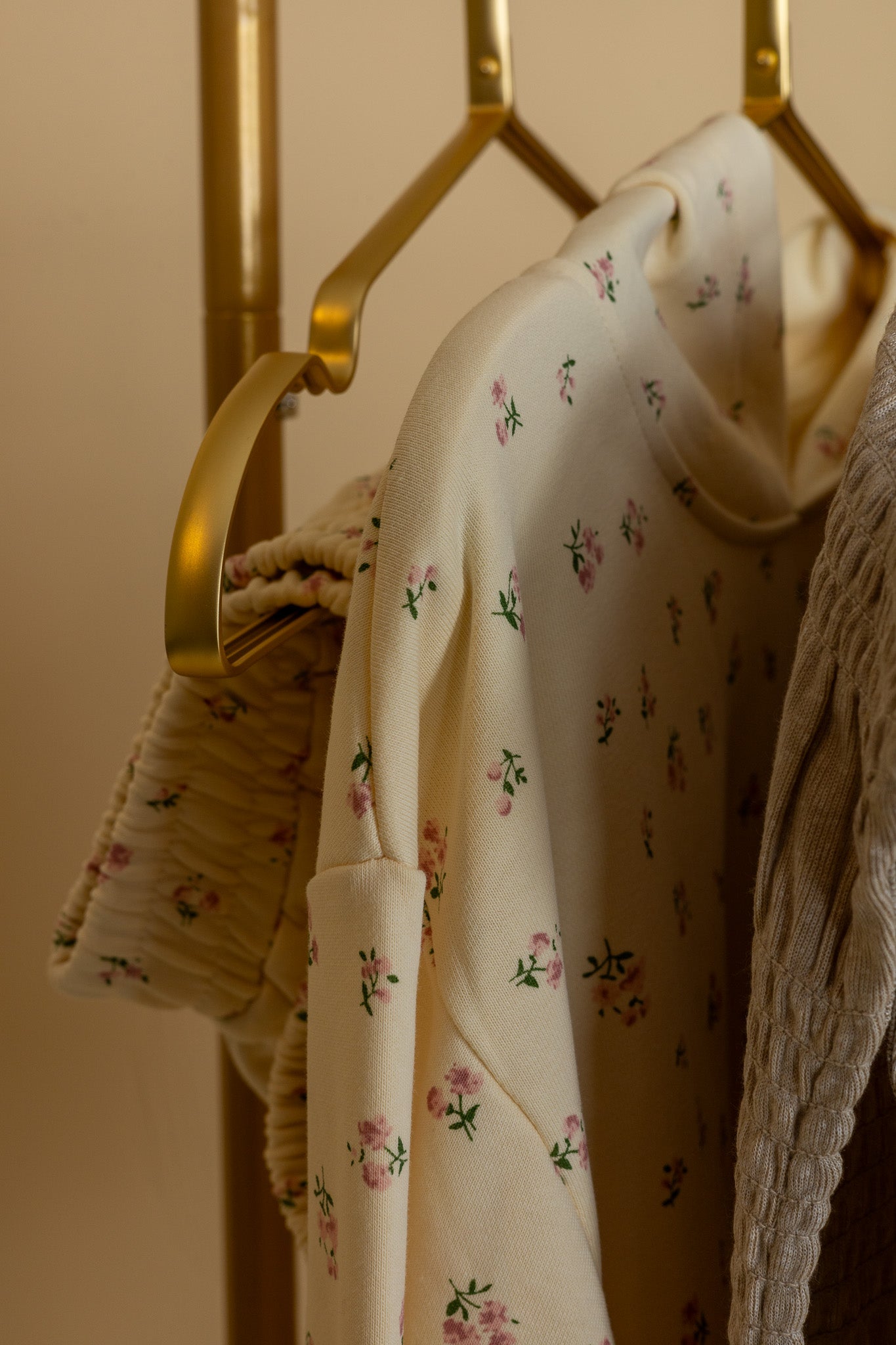 hanging shoulder Zoey Floral Short Set with lightweight hooded sweatshirt and elastic shorts with pockets in a playful floral print