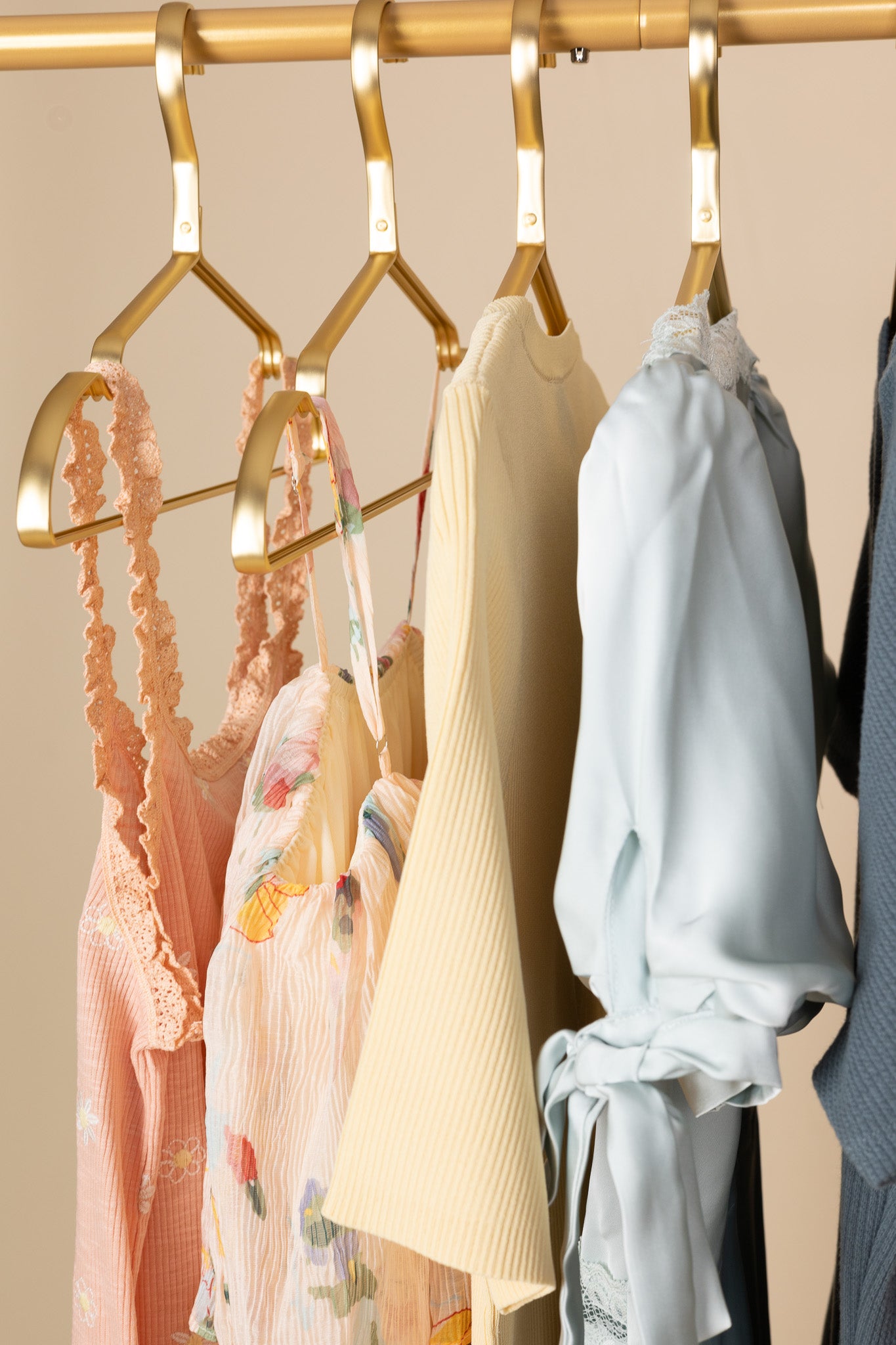 hanging Mila Sage Slip Dress in pastel blue/green with puff sleeves, bow details, lace accents, and midi length