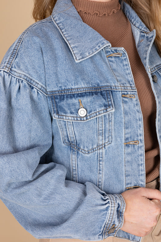 Women’s medium wash denim jacket with puff sleeves — slightly oversized jean jacket from ELLX Boutique