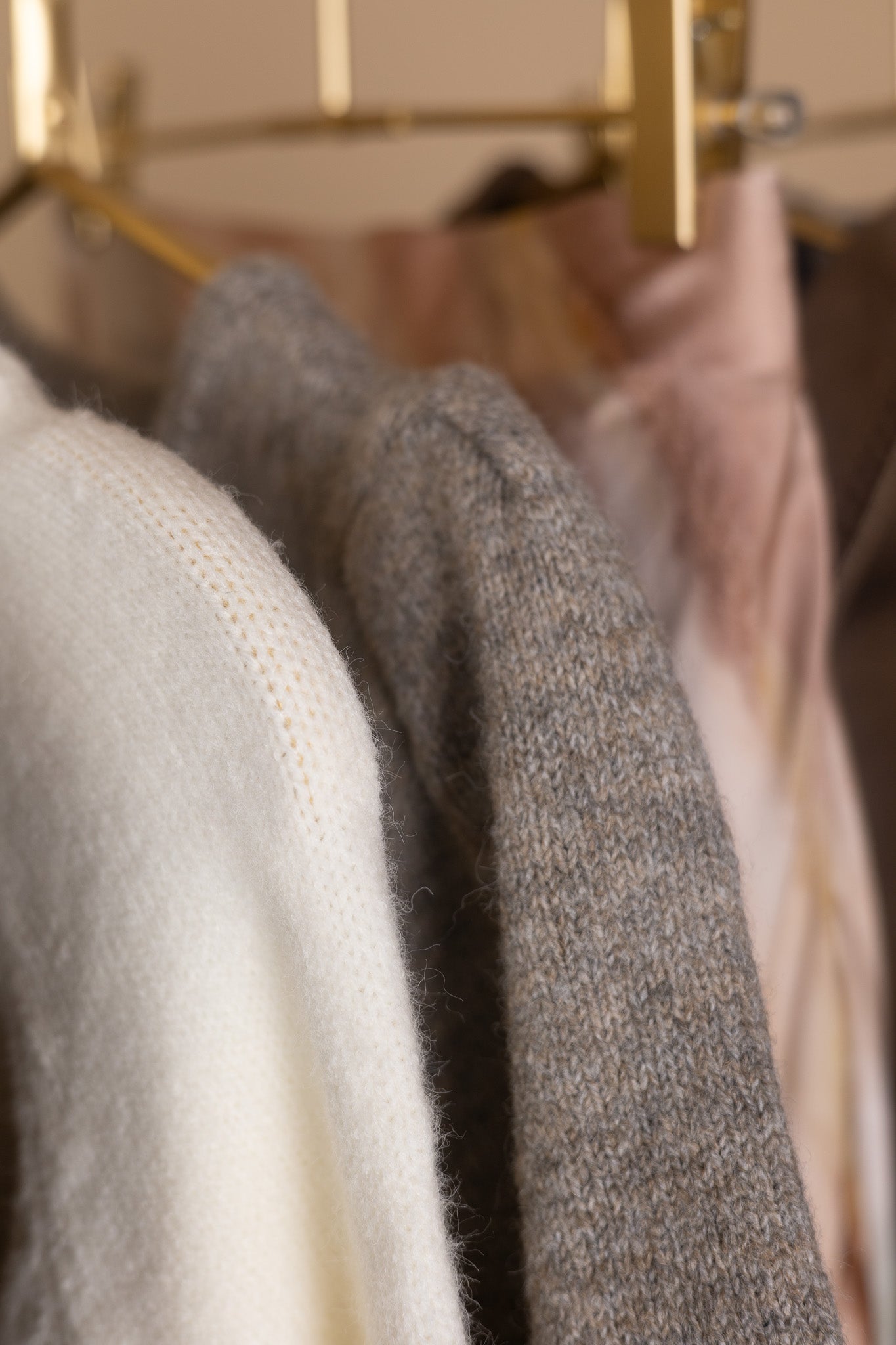 Puff sleeve and button detail on women’s heathered short sleeve cardigan — soft knit fabric texture close-up