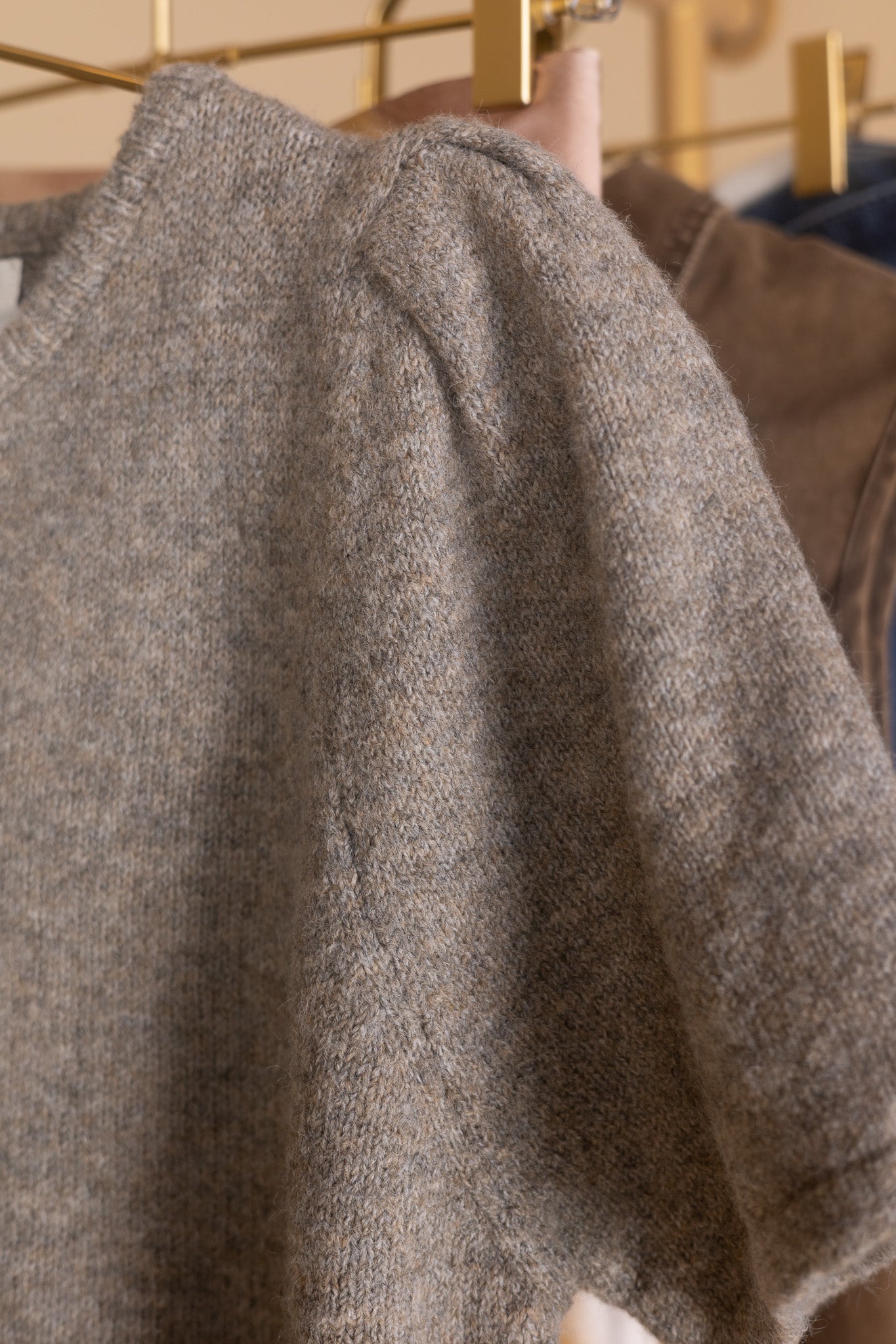 alternate view of Puff sleeve and button detail on women’s heathered short sleeve cardigan — soft knit fabric texture close-up