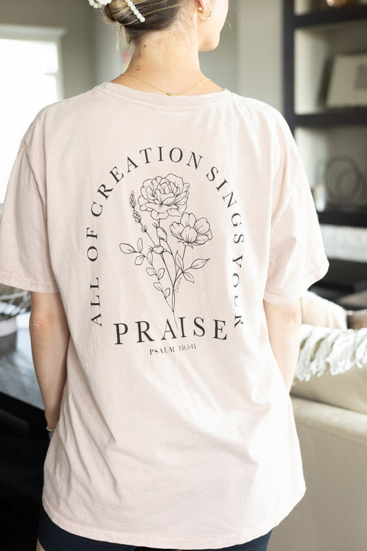 Mauve oversized floral tee with "Praise the Lord" on the front and Psalm 148: 1-14 on the back. Soft, comfy fabric with a mineral wash for a stylish touch. Ideal for a relaxed, faith-inspired outfit.