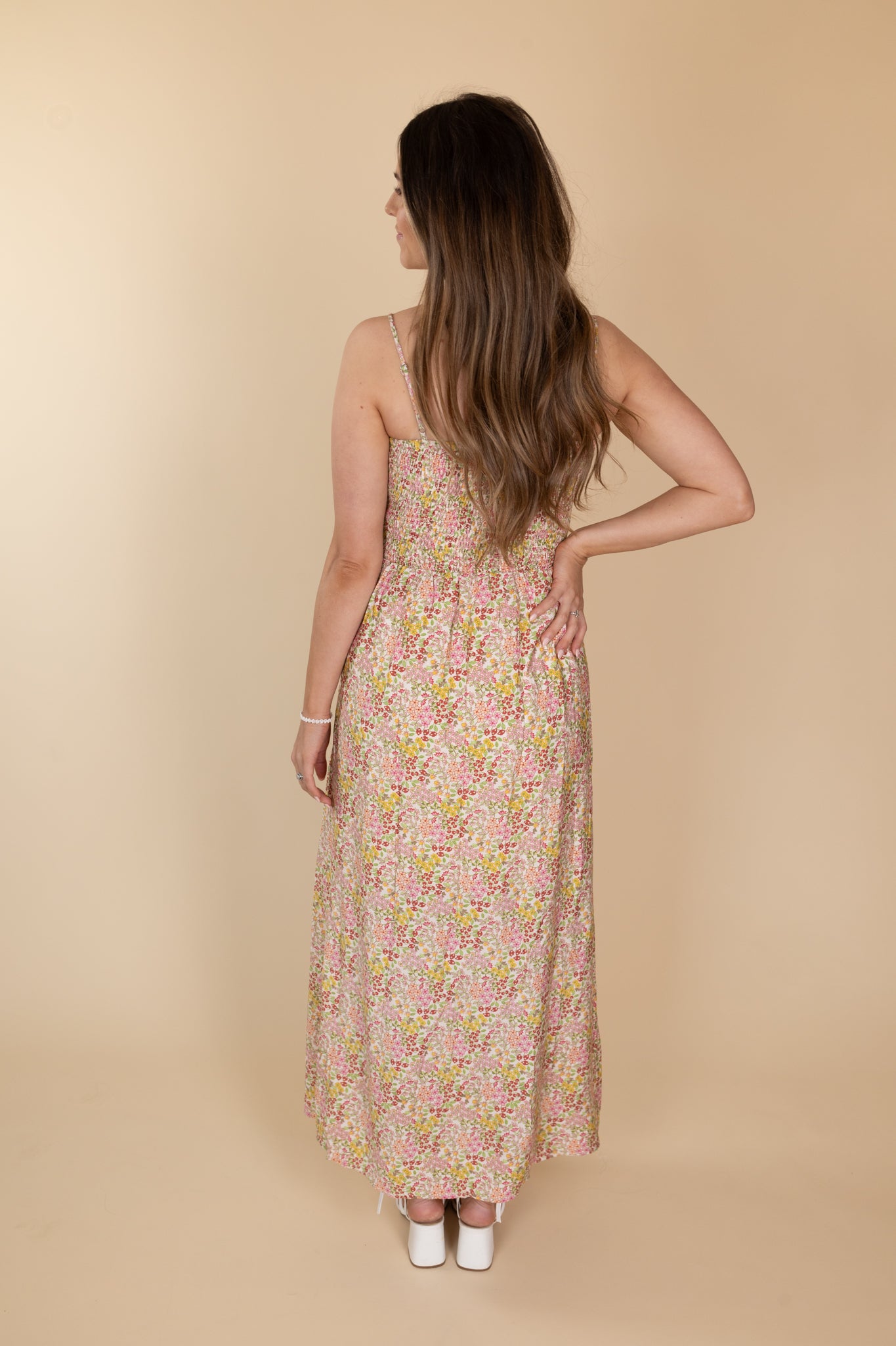 back view of “Maria Lace-Up Floral Midi Dress – a romantic floral print dress with lace-up detailing for a flattering, feminine look.”

