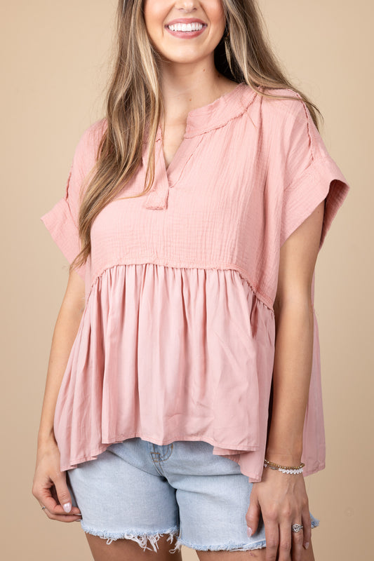 bradyn Flowy V Neck Top in pink with v-neck, raw hem detailing, and drop shoulder design. Flowy and below waist length.