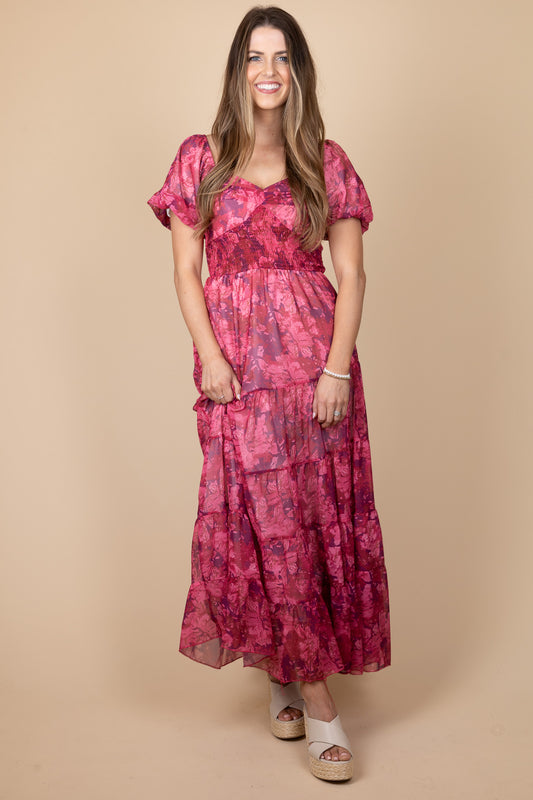 Wren Fuchsia Floral Dress with puff sleeves, sweetheart neckline, smocking through torso, and flowy midi length. True to size fit.