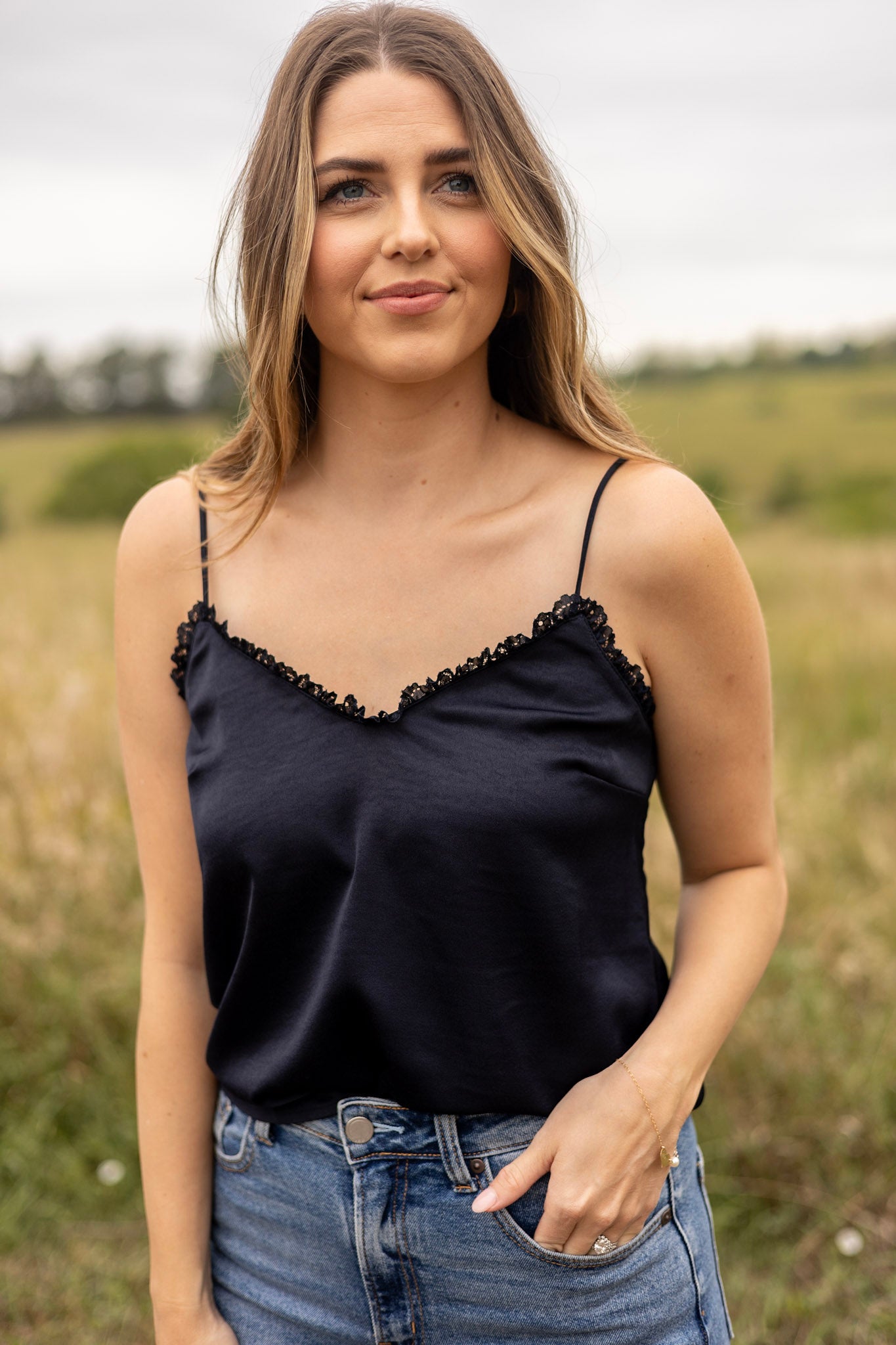 Mia Lace Trim Tank front view navy in color, adjustable spaghetti strap, paired with medium wash