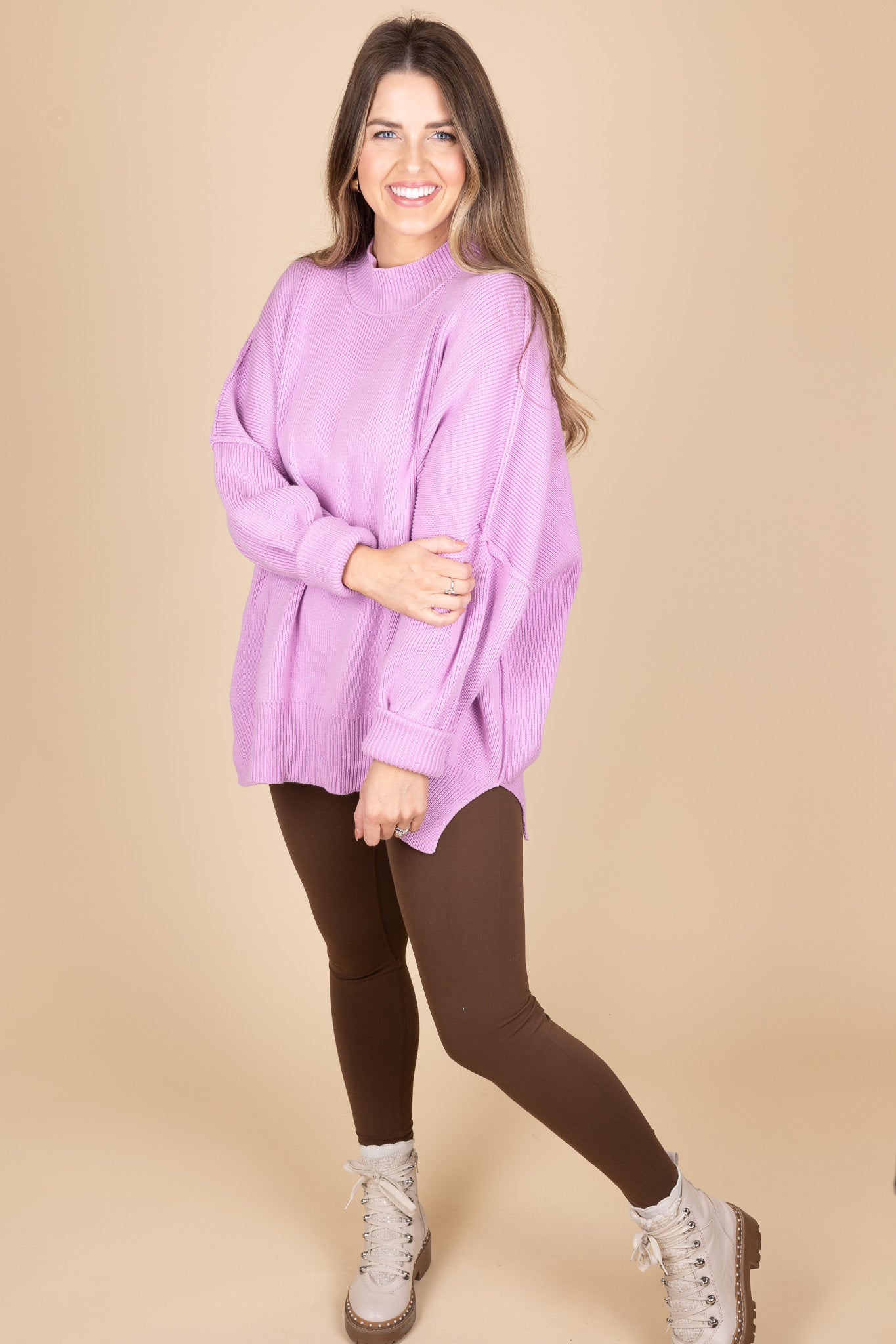 Orchid Oversized Sweater side view showing exposed seam and oversized comfy fit. Great paired with leggings because of tunic length.