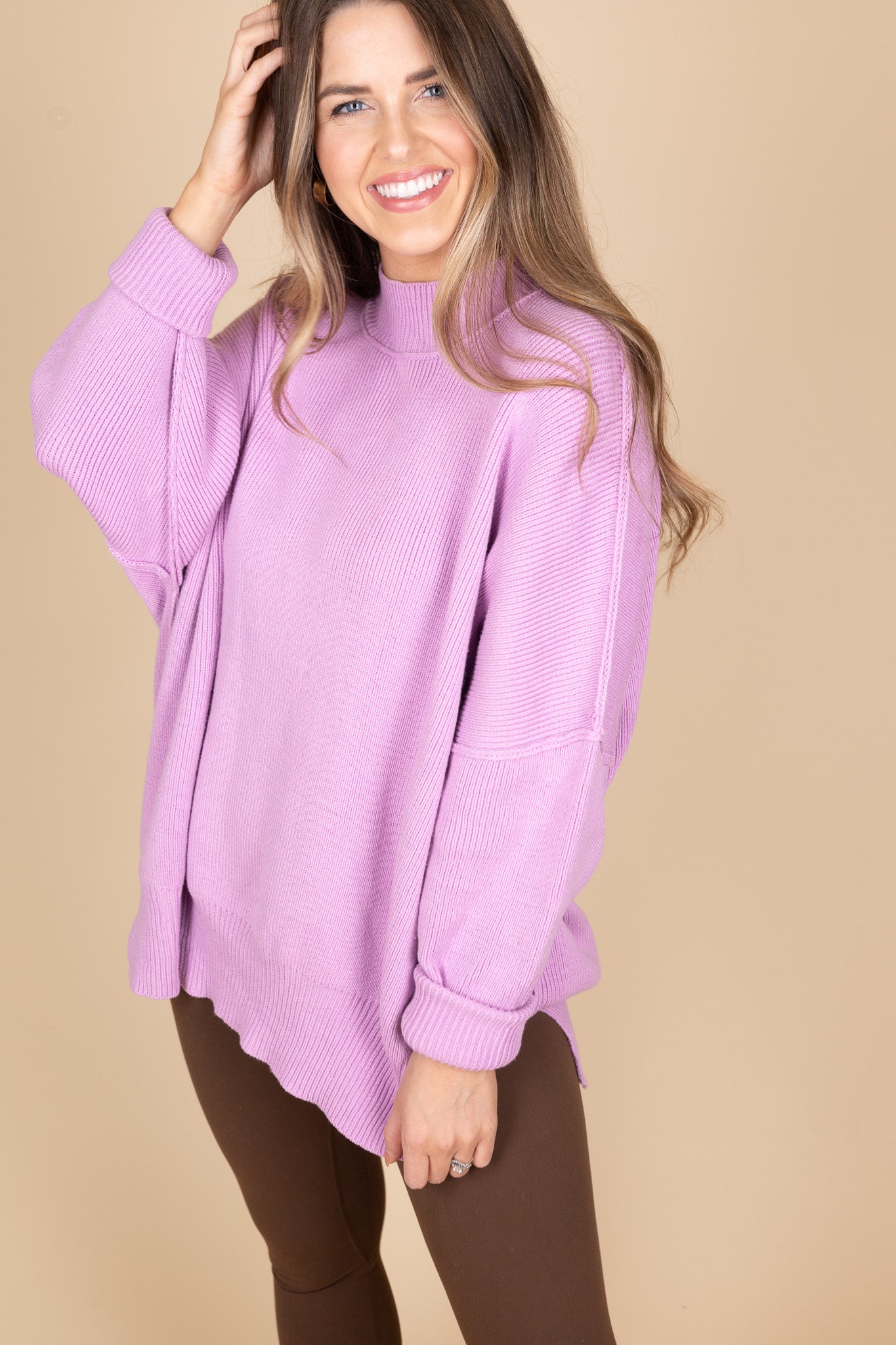 Orchid Oversized Sweater front view showing exposed seam and oversized comfy fit. Great paired with leggings because of tunic length.