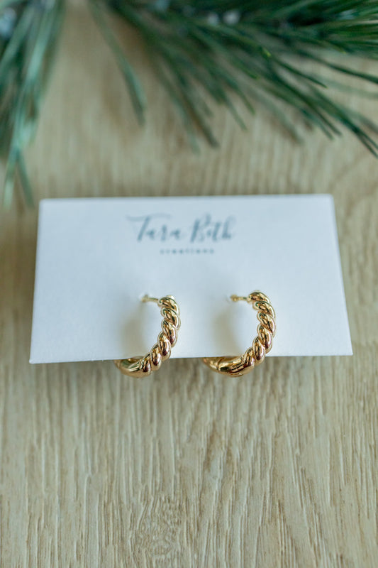 “Gold Twisted Hoops – elegant and lightweight hoop earrings with a modern twisted design for a timeless look.”

