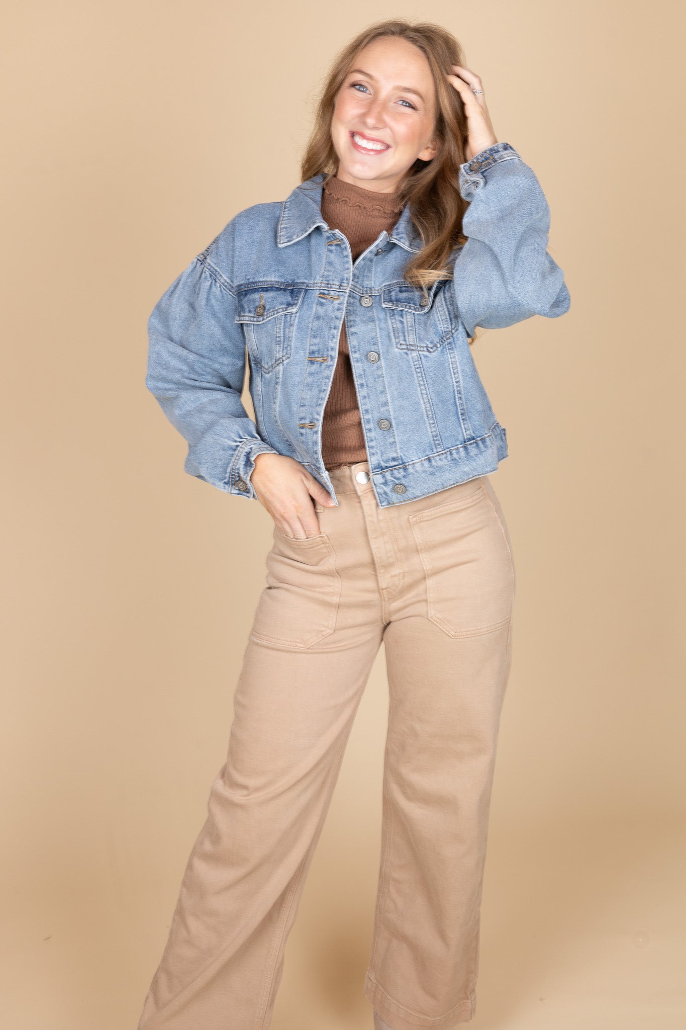 Trendy women’s outfit featuring puff sleeve denim jacket layered over a casual top — ELLX Boutique fall fashion