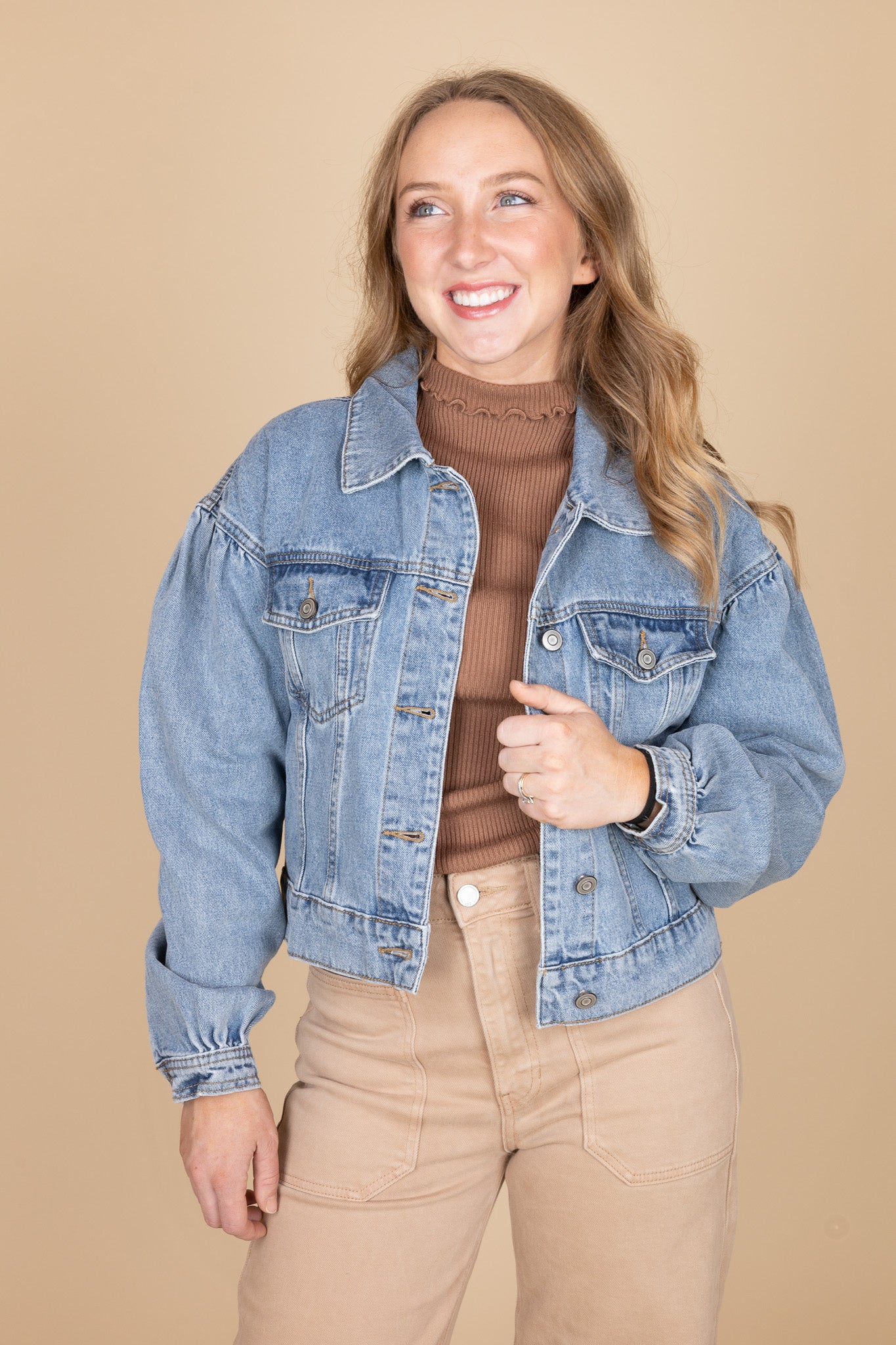 Puff sleeve and button detail on women’s medium wash denim jacket — soft structured jean fabric