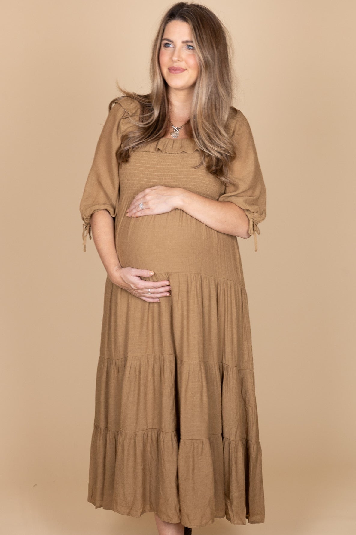 Elegant women’s fall outfit featuring brown ruffle midi dress with puff sleeves — seasonal fashion from ELLX Boutique