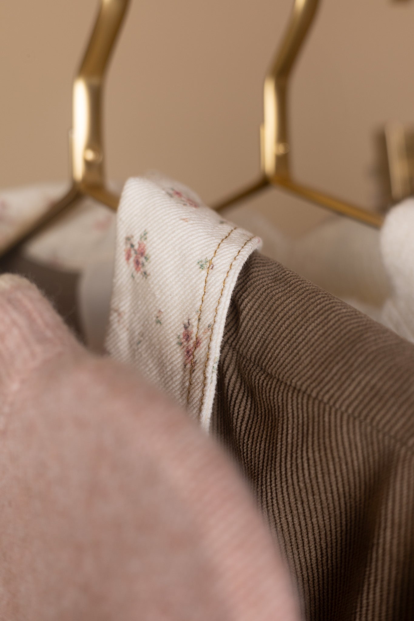close up detail of Women’s floral corduroy jacket in brown with pink and cream trim — oversized fit, lightweight fall layering piece from ELLX Boutique