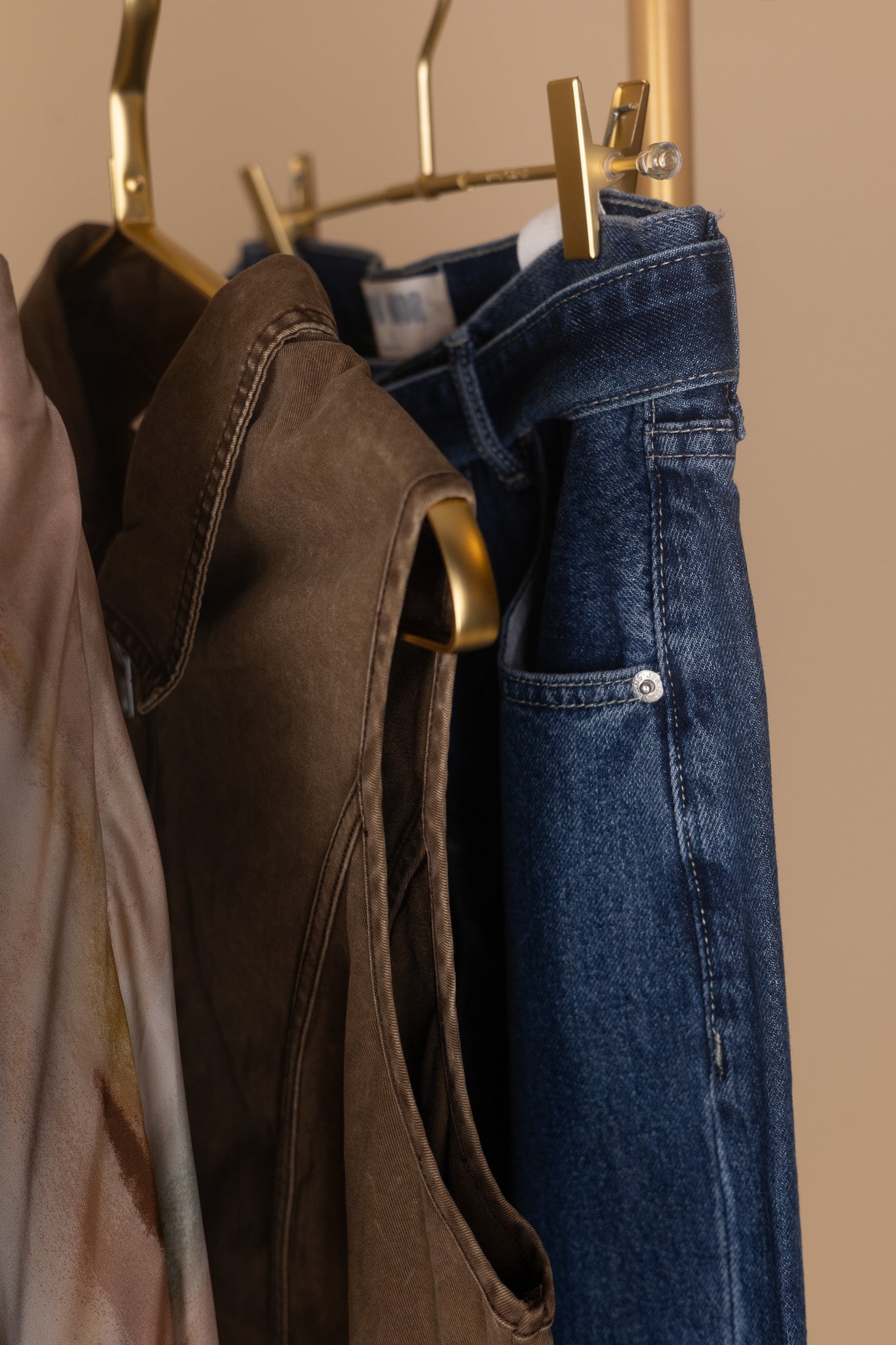 close up detail view of Women’s dark wash cuffed wide leg jeans with removable belt — modern high waist denim from ELLX Boutique