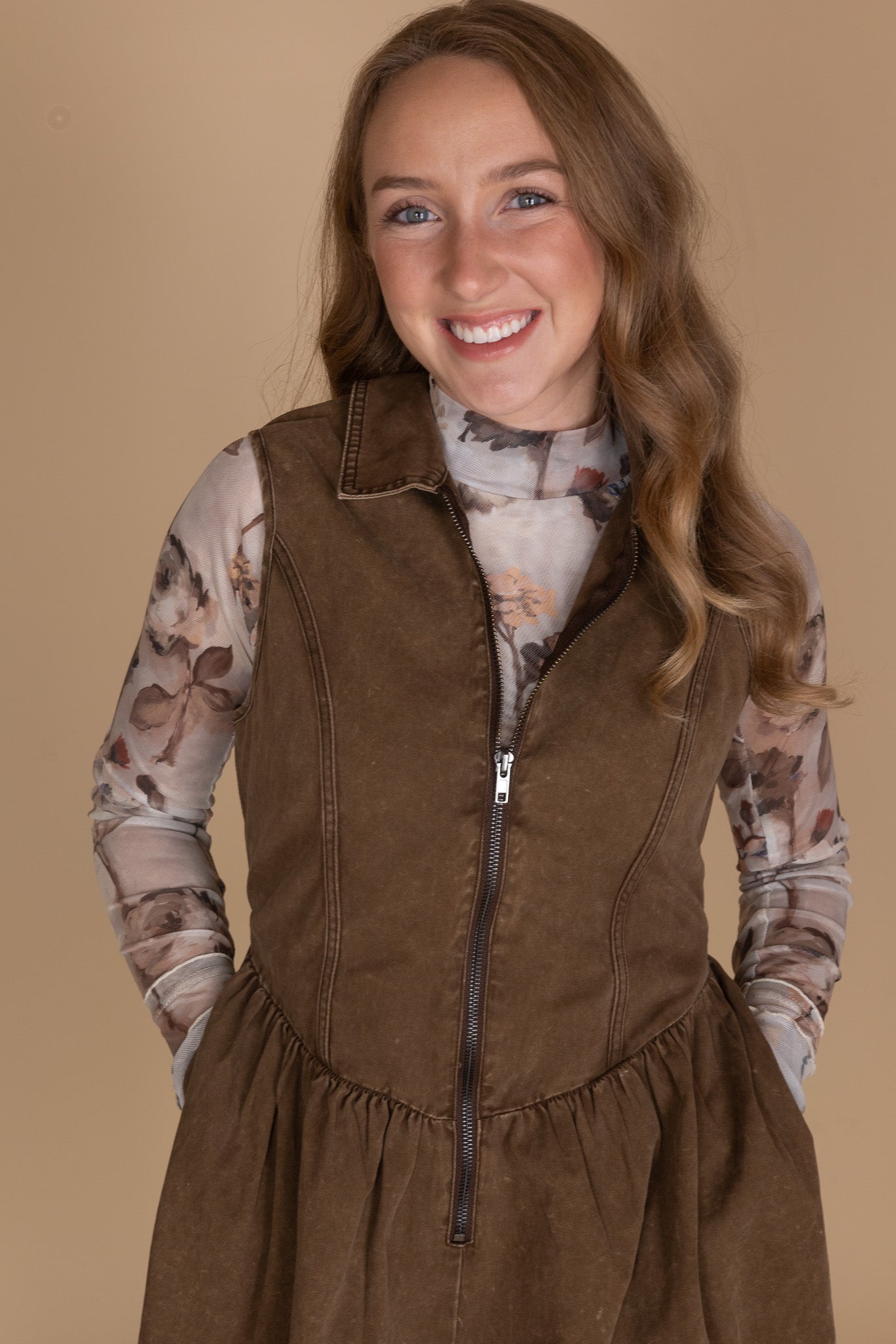 alternate Front zipper and V-hem waist detail on women’s twill denim mini dress — structured fabric close-up